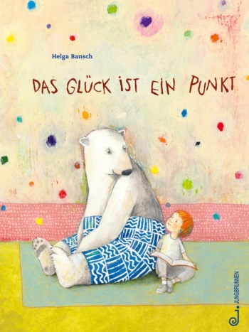 Ein Eisbär in Hosen und ein Junge lesen in einem Buch