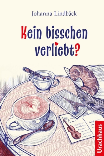 Ein Cafétisch - darauf sind ein Brotkorb mit einem Croissant, eine Tasse Cappuchino eine Zuckerdose mit Löffel sowie Postkarten.