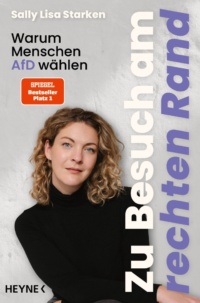 Eine blonde Frau im schwarzen Pullover, die uns ansieht